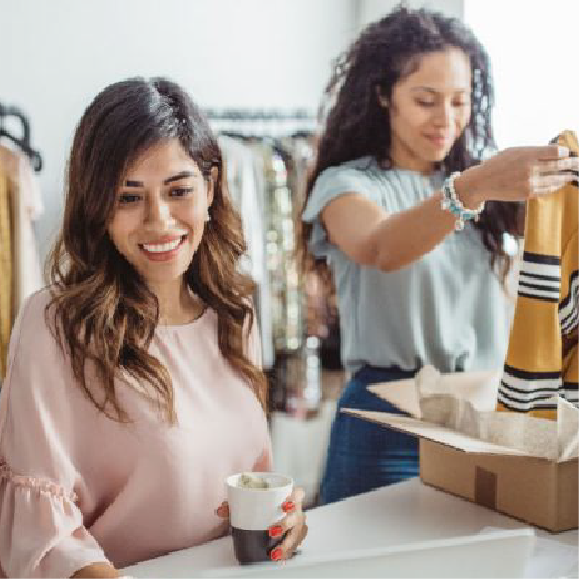 A woman making coffee in a high street coffee shop