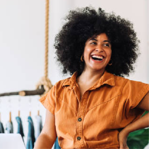 Woman smiling in a clothes shop